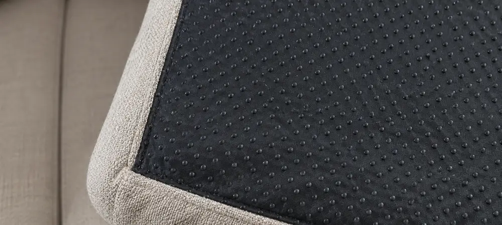 Non-slip pad under a couch cushion