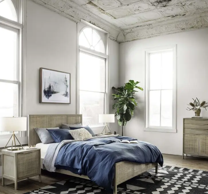 Single oversized art piece above the bed