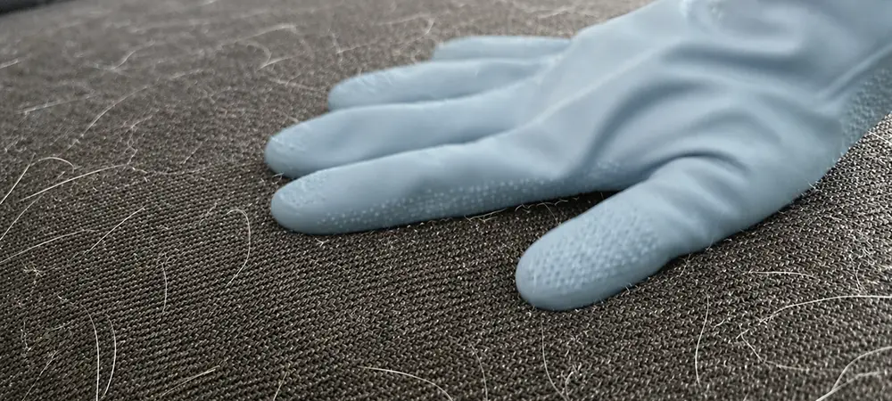 Lift surface hair with a dampened rubber glove