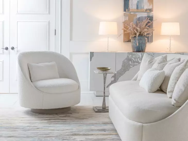 Genevieve White Upholstered Swivel Chair with Pillow