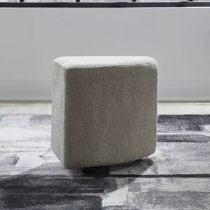 Capri Textured Taupe Upholstered Wedge Ottoman with Casters