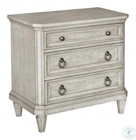 cream dresser and nightstand