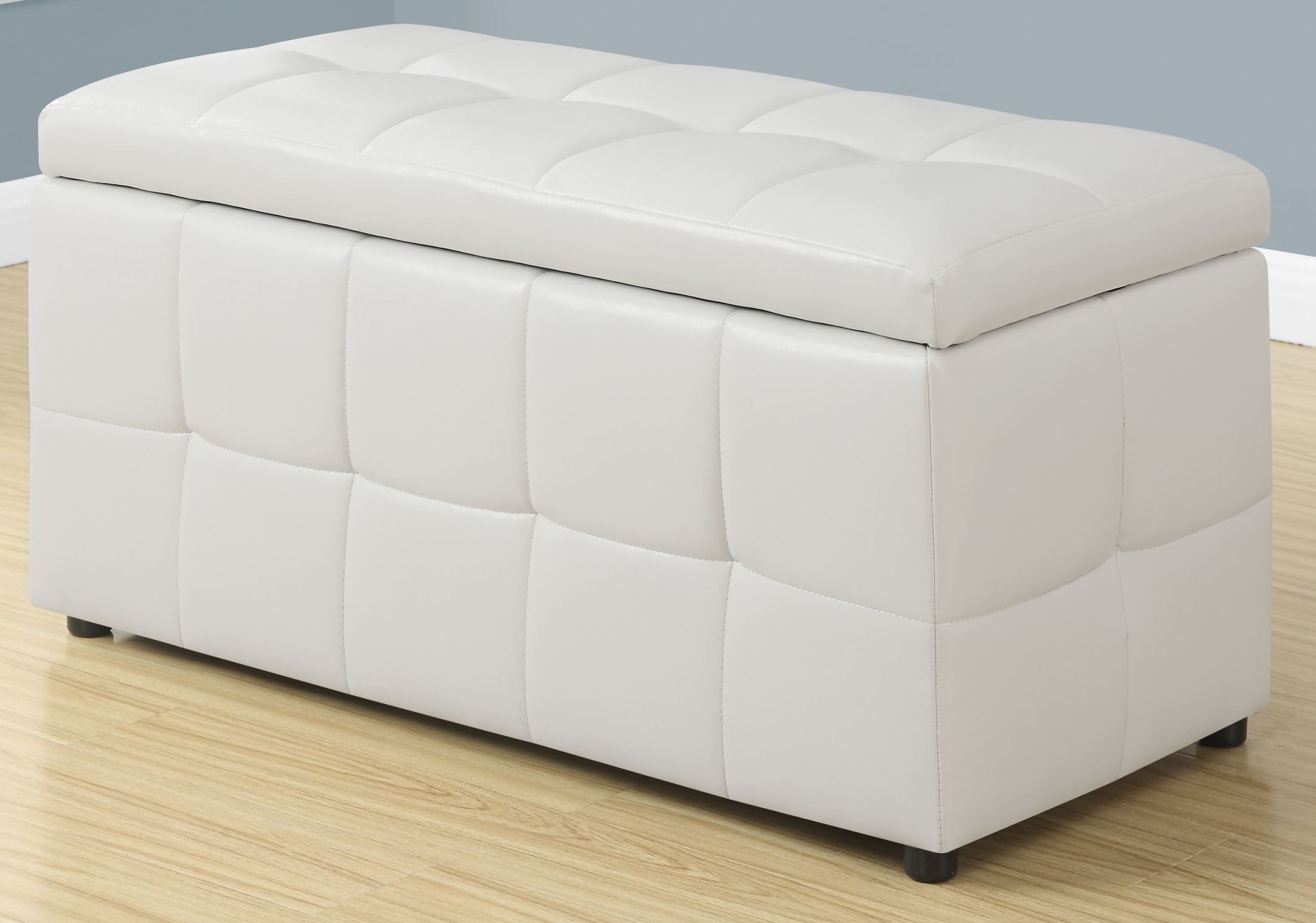 white leather sofa and ottomans