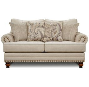 Cary's Doe Beige 78" Loveseat with Nailhead Trim and Throw Pillows