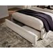 Shoralli Beige Queen Upholstered Storage Panel Bed