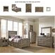 Trinell Brown Five Drawer Chest