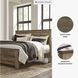 Trinell Brown King Panel Bed