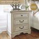 Realyn Chipped White 3 Drawer Nightstand
