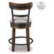 Valebeck Brown Upholstered Swivel Counter Height Stool