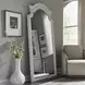 Southern Manor Antique White and Weathered Bark Arched Floor Mirror
