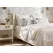 Haven Warm White King Upholstered Finial Poster Bed