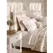 Haven Warm White Queen Upholstered Finial Poster Bed