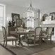 Americana Farmhouse Dusty Taupe and Brown Upholstered 7 Piece Extendable Rectangular Trestle Base Dining Set with Nailhead Trim