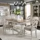 Farmhouse Reimagined Antique White and Chestnut Upholstered 5 Piece Extendable Trestle Base Dining Set