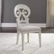 Farmhouse Reimagined Antique White and Chestnut Upholstered 7 Piece Extendable Trestle Base Dining Set