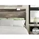 Jusika Brown King Panel Storage Bed