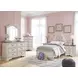 Realyn Chipped White and Brown 6 Drawer Dresser and Arched Mirror