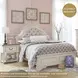 Realyn Chipped White Full Upholstered Panel Bed