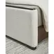 Darimore Burnished Brown and White Performance Fabric California King Upholstered Panel Bed