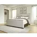 Darimore Burnished Brown and White Performance Fabric Queen Upholstered Panel Bed
