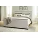 Darimore Burnished Brown and White Performance Fabric California King Upholstered Panel Bed