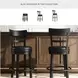 Valebeck Black Upholstered Swivel Counter Height Stool With Ladder Back