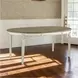 Realyn White Oval Extendable Dining Table
