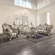 Danae Champagne and Gold Upholstered Lounge Chair with Pillows and Nailhead trim